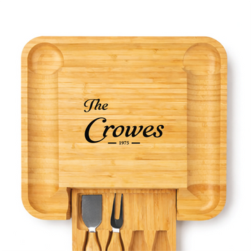Personalized square bamboo charcuterie board engraved for the Crowes with pull-out utensil drawer
