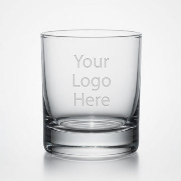 Clear rocks glass engraved with a placeholder logo on a light background.