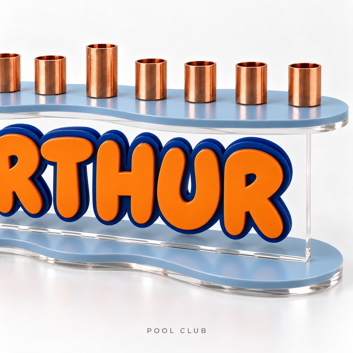 Close-up of The Contour in Pool Club showing layered orange and navy acrylic lettering, clear panel, blue curved plates and copper candle cups