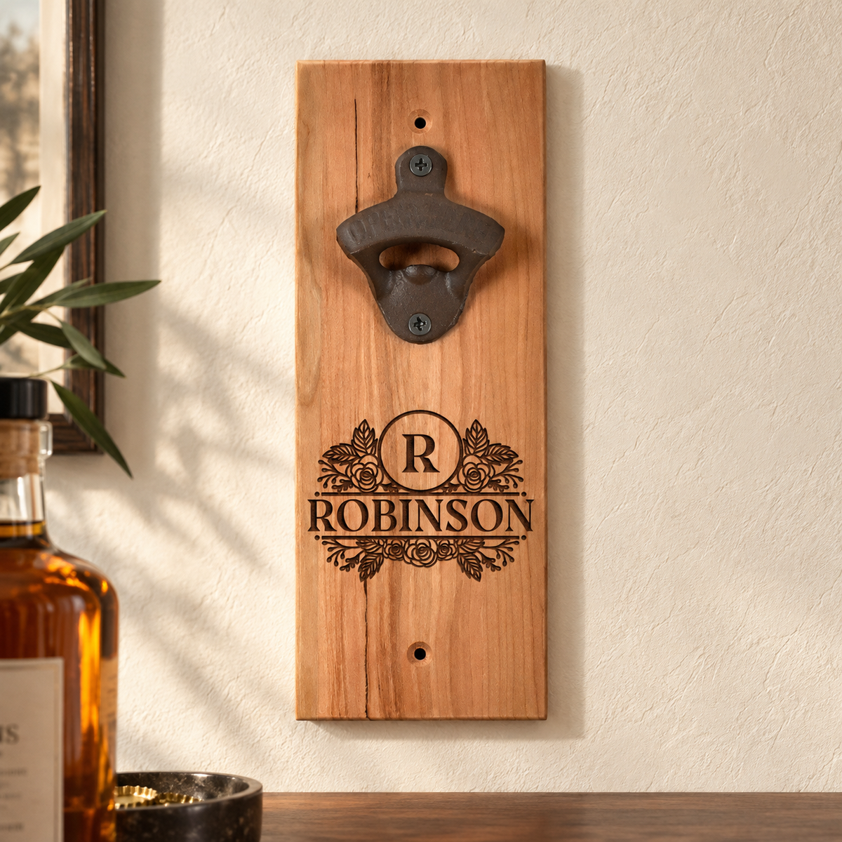 Engraved Robinson cherry wood bottle opener mounted straight on a plaster wall