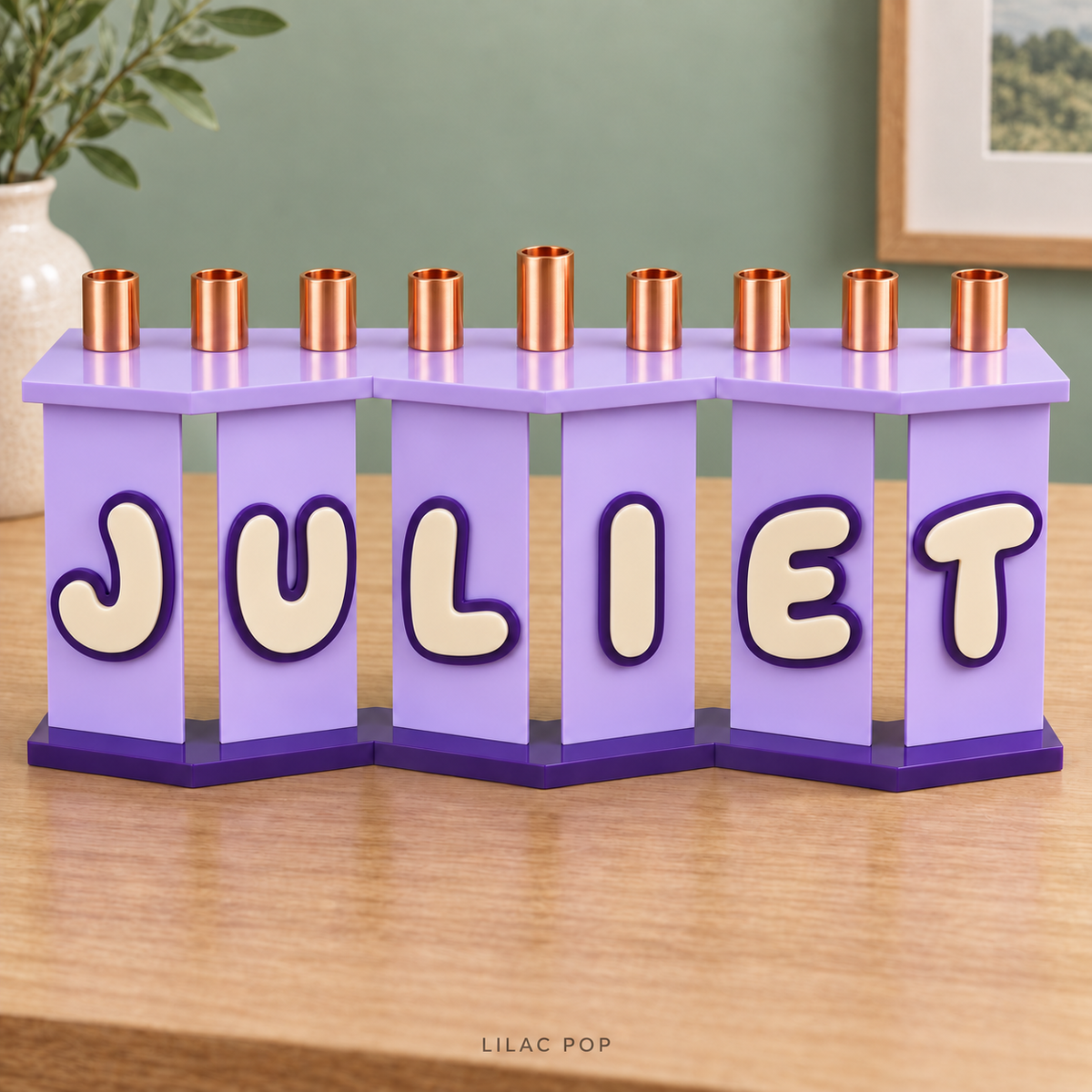 JULIET acrylic menorah in Lilac Pop with Lavender panels, Eggshell layered letters and Purple outlines on an oak console.