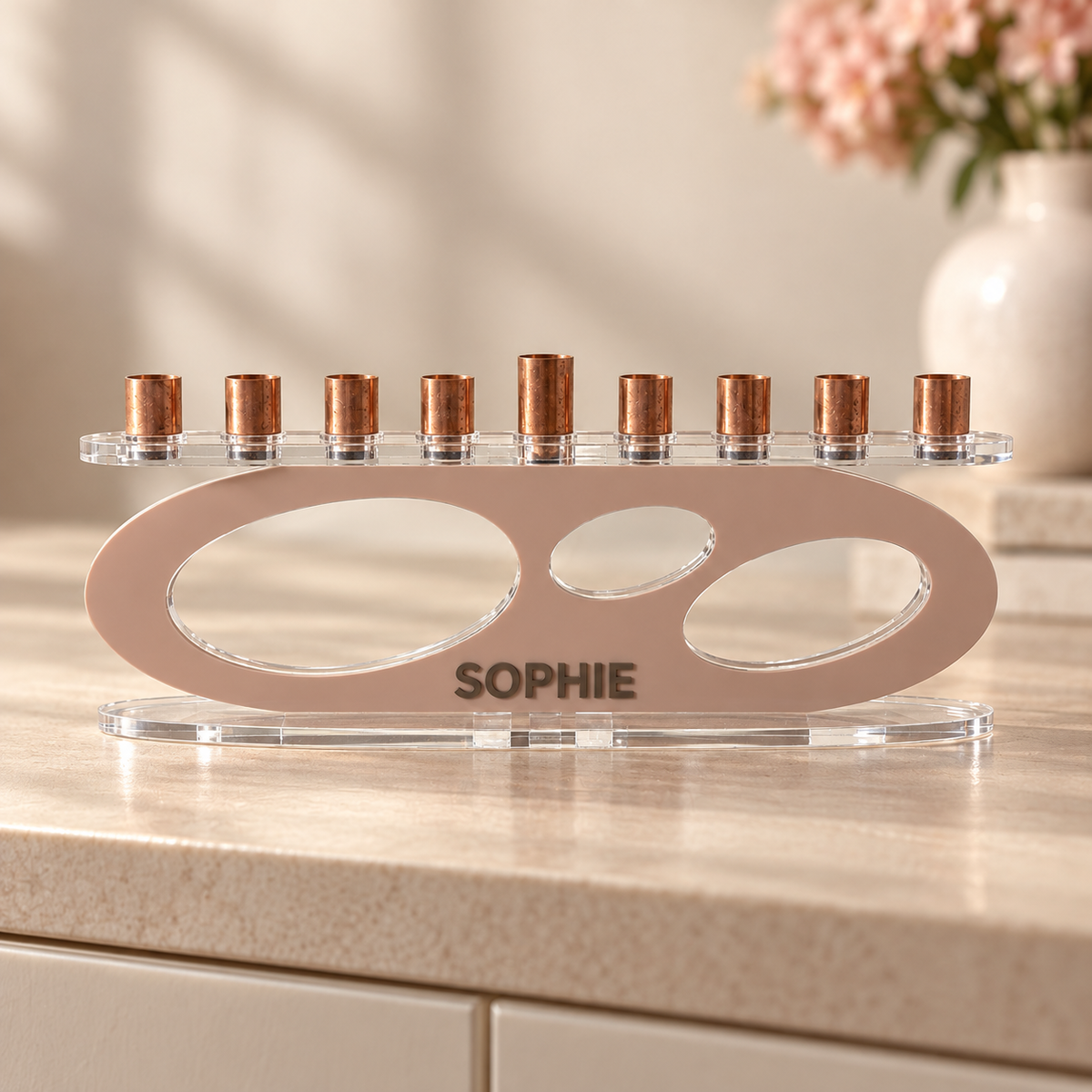 SOPHIE personalized Forma menorah in Blush with Milk Chocolate lettering, clear oval base and copper candle cups