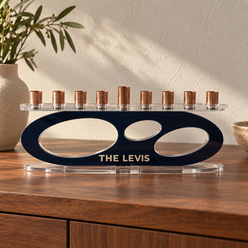 THE LEVIS personalized Forma menorah in Navy with Linen lettering, clear oval base and copper candle cups