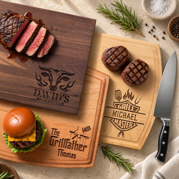 Personalized BBQ cutting boards in maple, cherry and walnut, styled on limestone