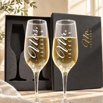 Personalized Champagne Flute Glass Set - "Mr & Mrs Vertical" — engraved detail, styled in natural daylight
