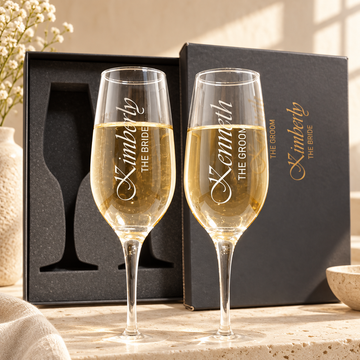 Personalized Champagne Flute Glass Set - "The Groom & The Bride" — engraved detail, styled in natural daylight