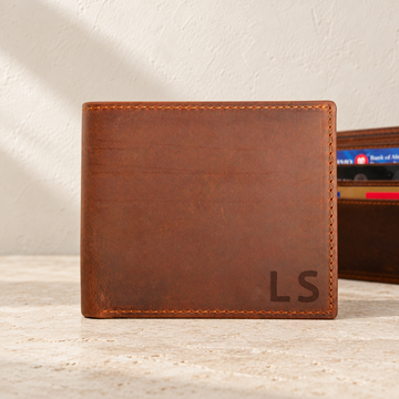 The Wallet — personalized leather detail in soft daylight