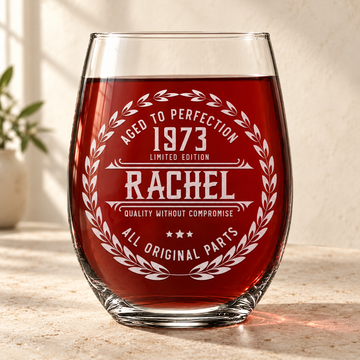 Personalized Stemless Wine Glass - "Aged to Perfection" — engraved detail, styled in natural daylight