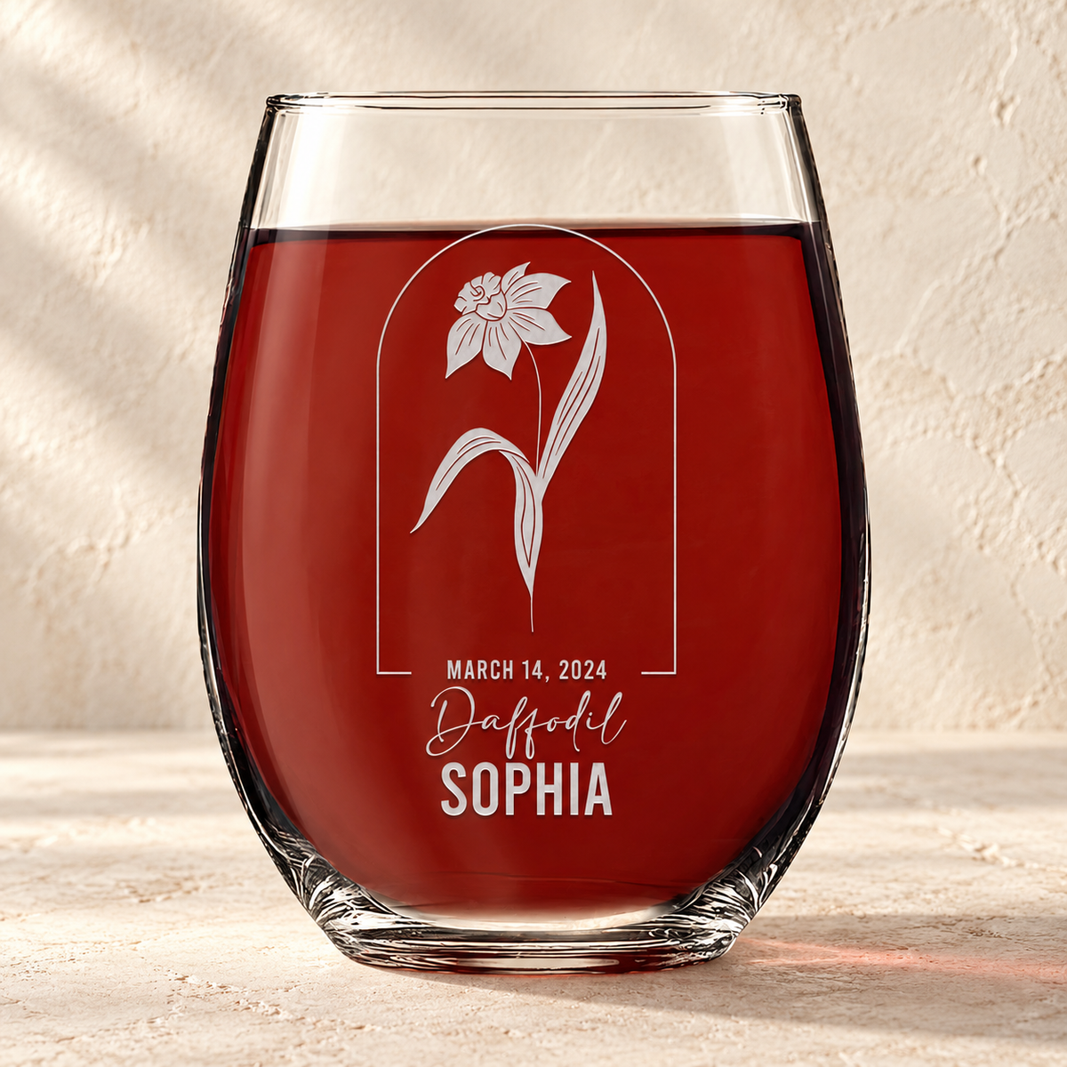 Personalized Stemless Wine Glass - Birth Flowers - "Daffodil March" — editorial product photograph