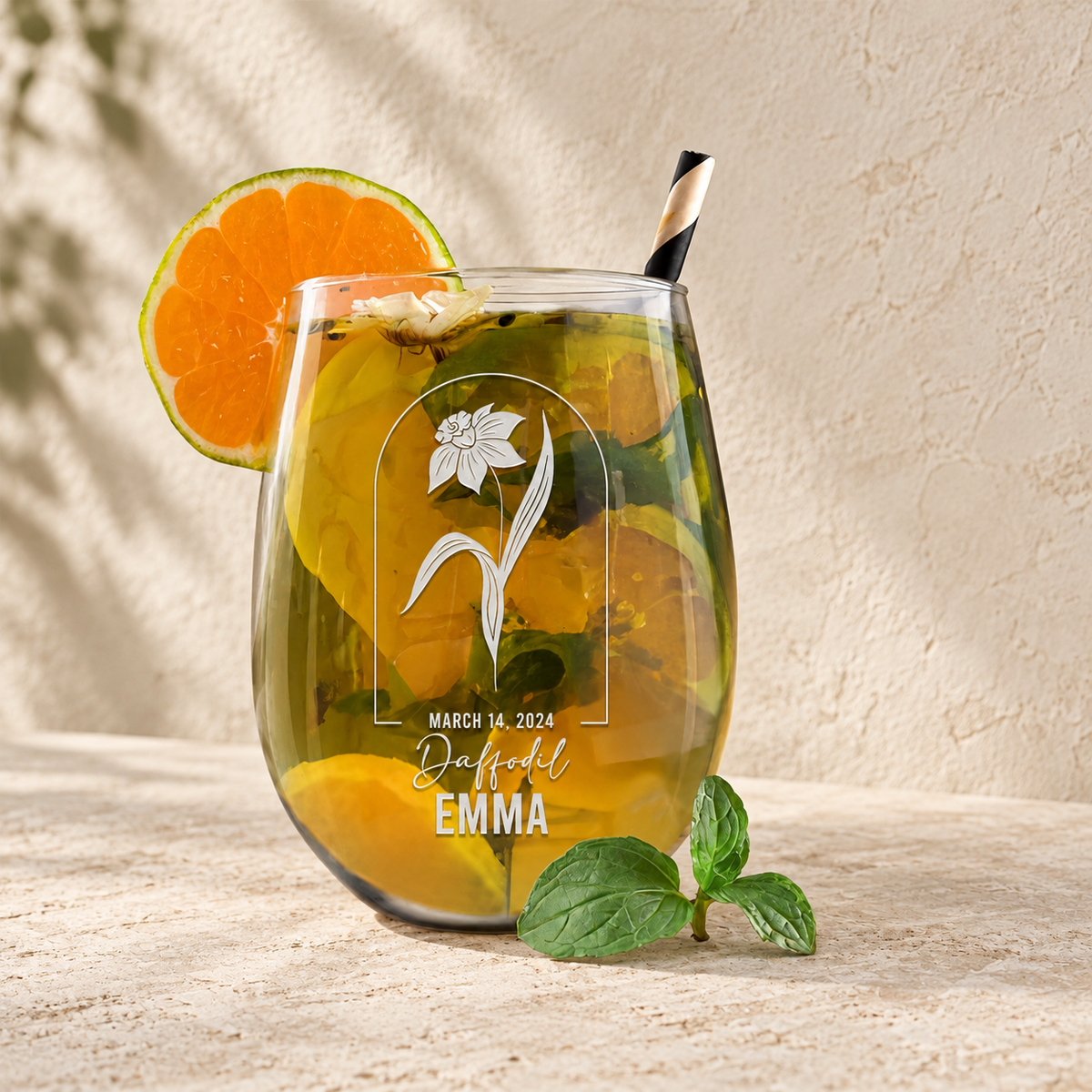 Personalized Stemless Wine Glass - Birth Flowers - "Daffodil March" — editorial product photograph