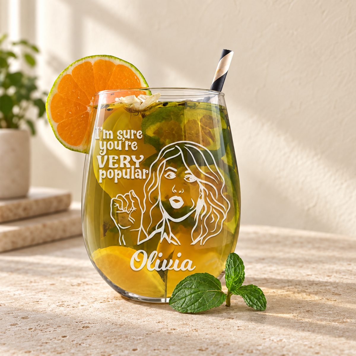 Personalized Stemless Wine Glass - "I'm Sure You're Very Popular" — engraved detail, styled in natural daylight