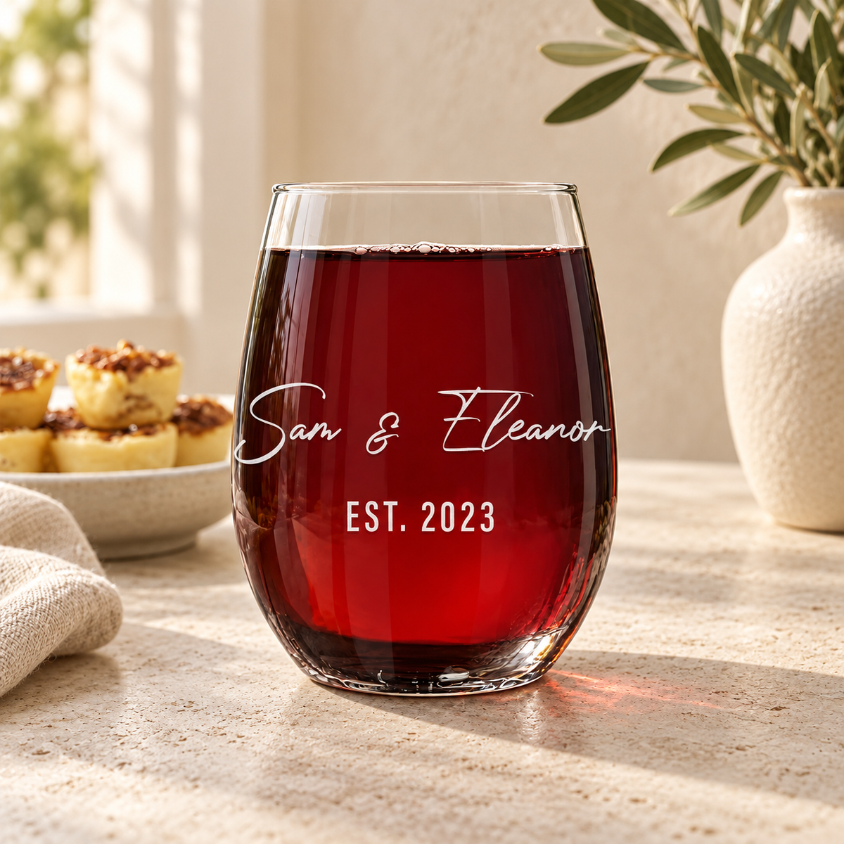 Personalized Stemless Wine Glass Set - "Couple's Names" — engraved detail, styled in natural daylight