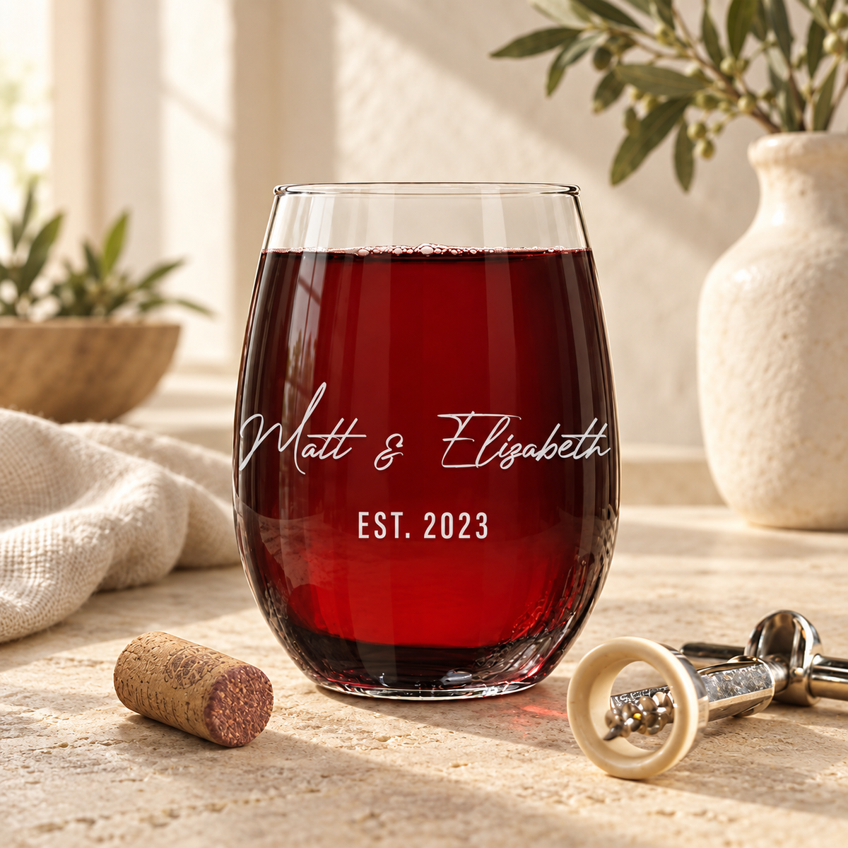 Personalized Stemless Wine Glass Set - "Couple's Names" — engraved detail, styled in natural daylight