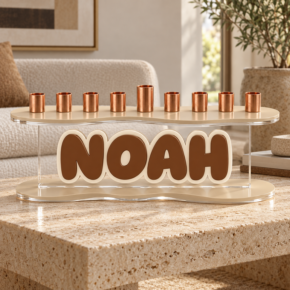 NOAH acrylic menorah with beige curved plates and cream outlined brown name on travertine