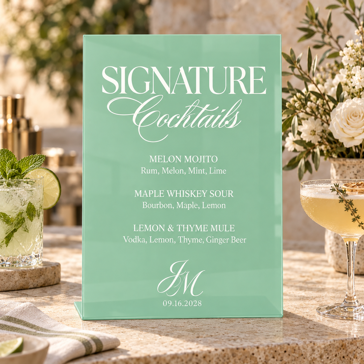 Honeydew personalized acrylic drink menu displayed with flowers and glassware
