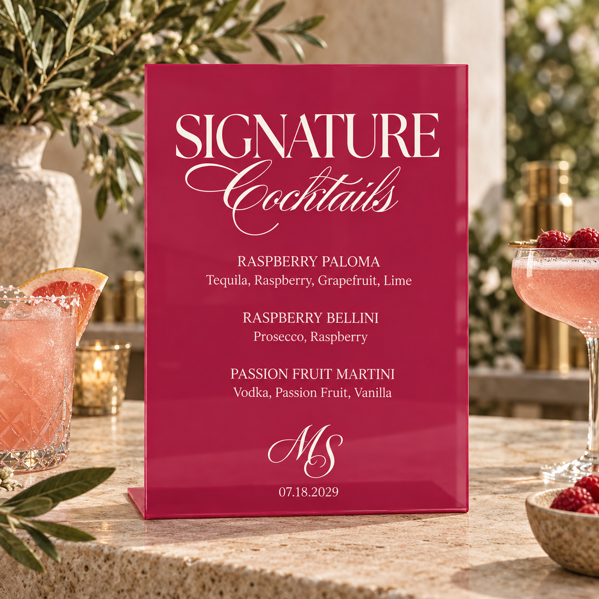 Hot Pink personalized signature drink sign on a stone bar with flowers and cocktails
