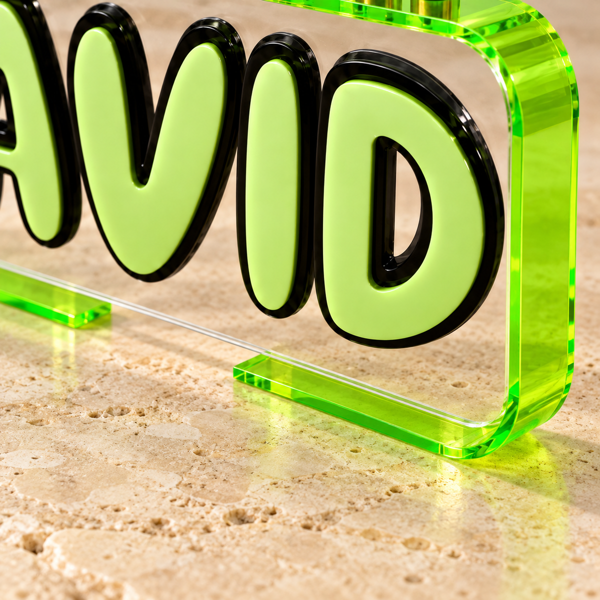Close-up of thin neon acrylic base ends and continuous clear panel on the DAVID Loop menorah