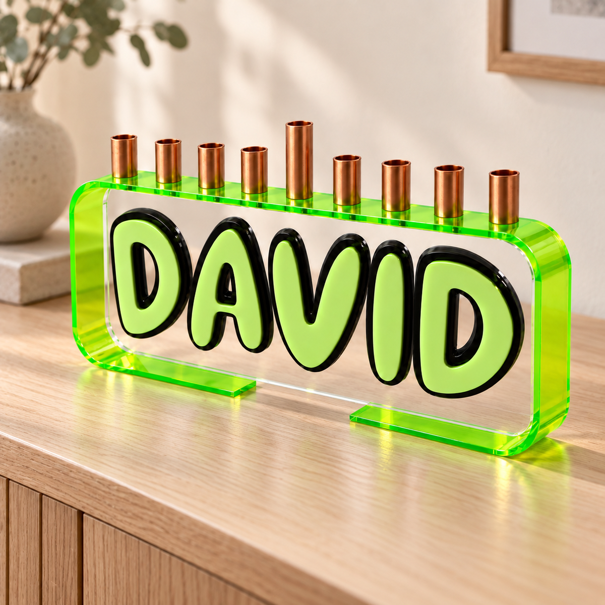 DAVID Loop menorah with neon green bent acrylic frame on an oak console