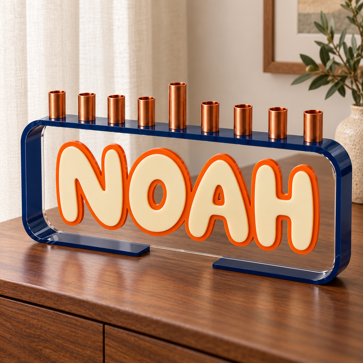 NOAH Loop menorah with navy frame and cream lettering with orange outline on walnut