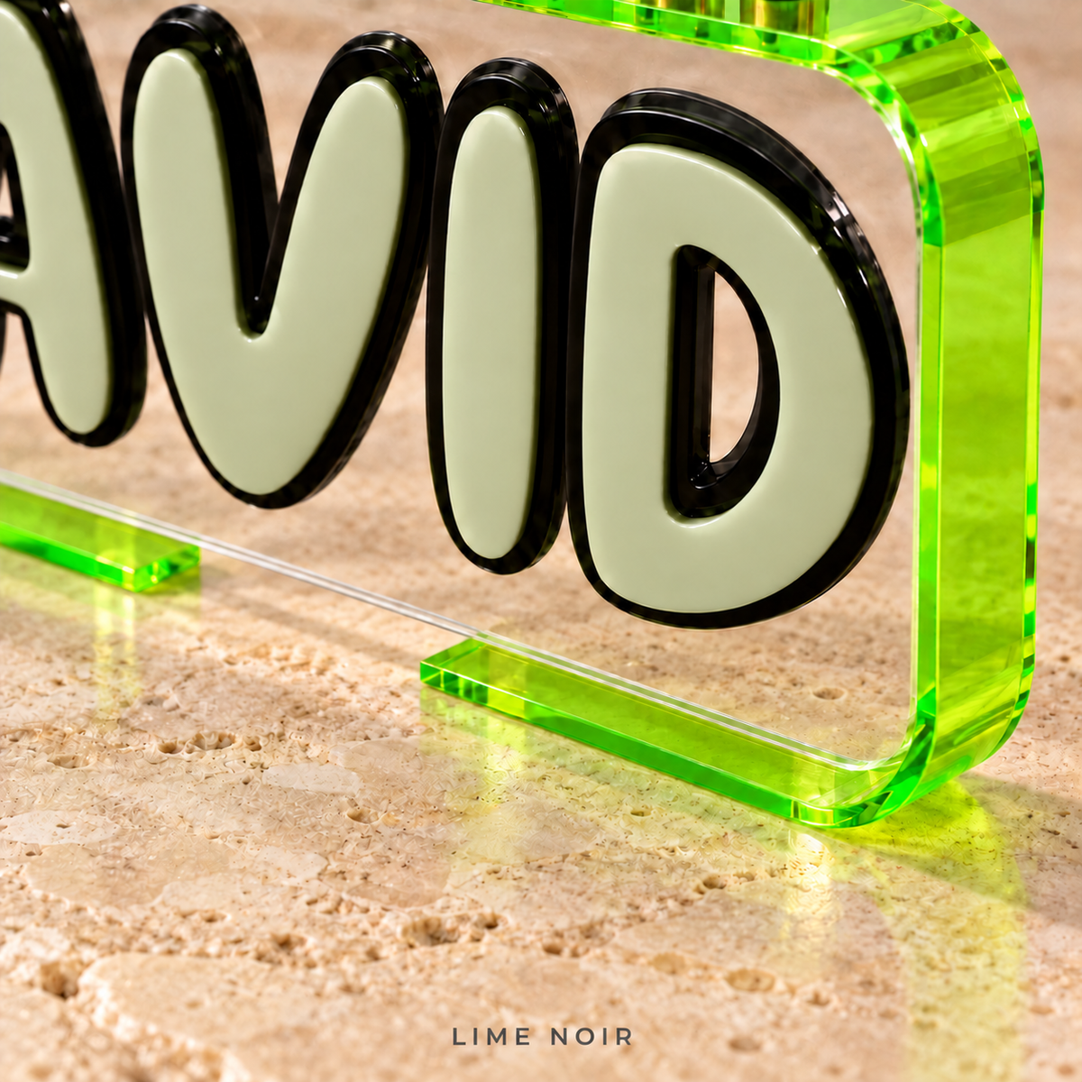 Close-up of The Loop in Lime Noir, showing Aloe letters with Black outlines, a clear front panel and Neon Green/Yellow acrylic frame.