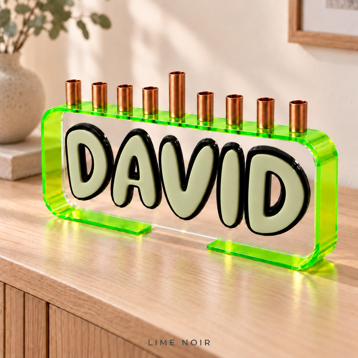 The Loop menorah in Lime Noir with a Neon Green/Yellow frame, Aloe DAVID letters, Black outlines and clear front panel.