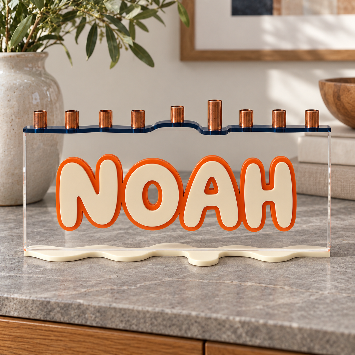 NOAH custom acrylic menorah with navy top, cream letters and orange outline