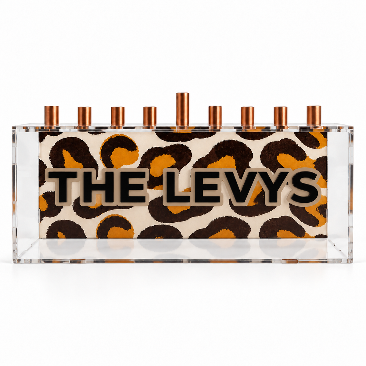 THE LEVYS leopard print acrylic menorah with black family name and teddy outline, front studio view