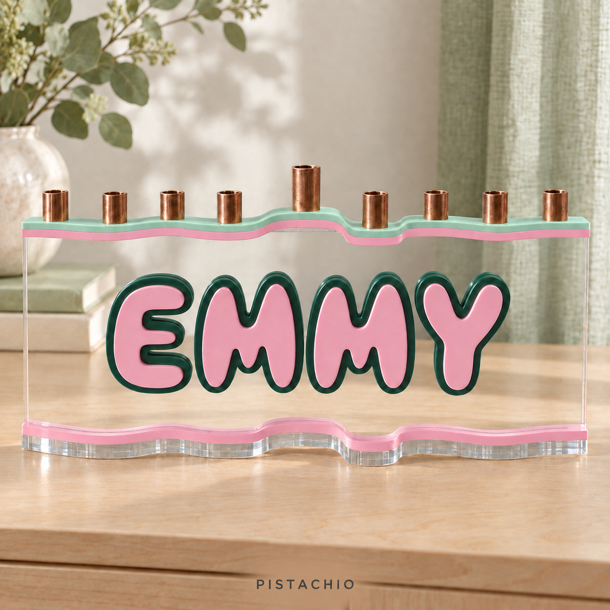 EMMY custom acrylic menorah in Pistachio, with Honeydew pale mint green top, Rose soft pink letters and matching base, Pine dark forest green outlines and clear acrylic.
